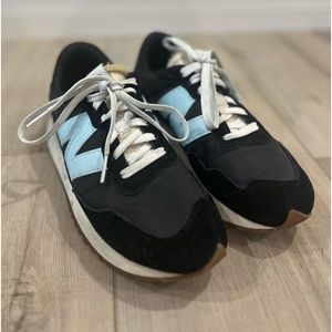 Black new balance shoe, size 9.